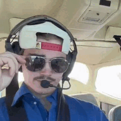 Pilot Adjusting Sunglasses